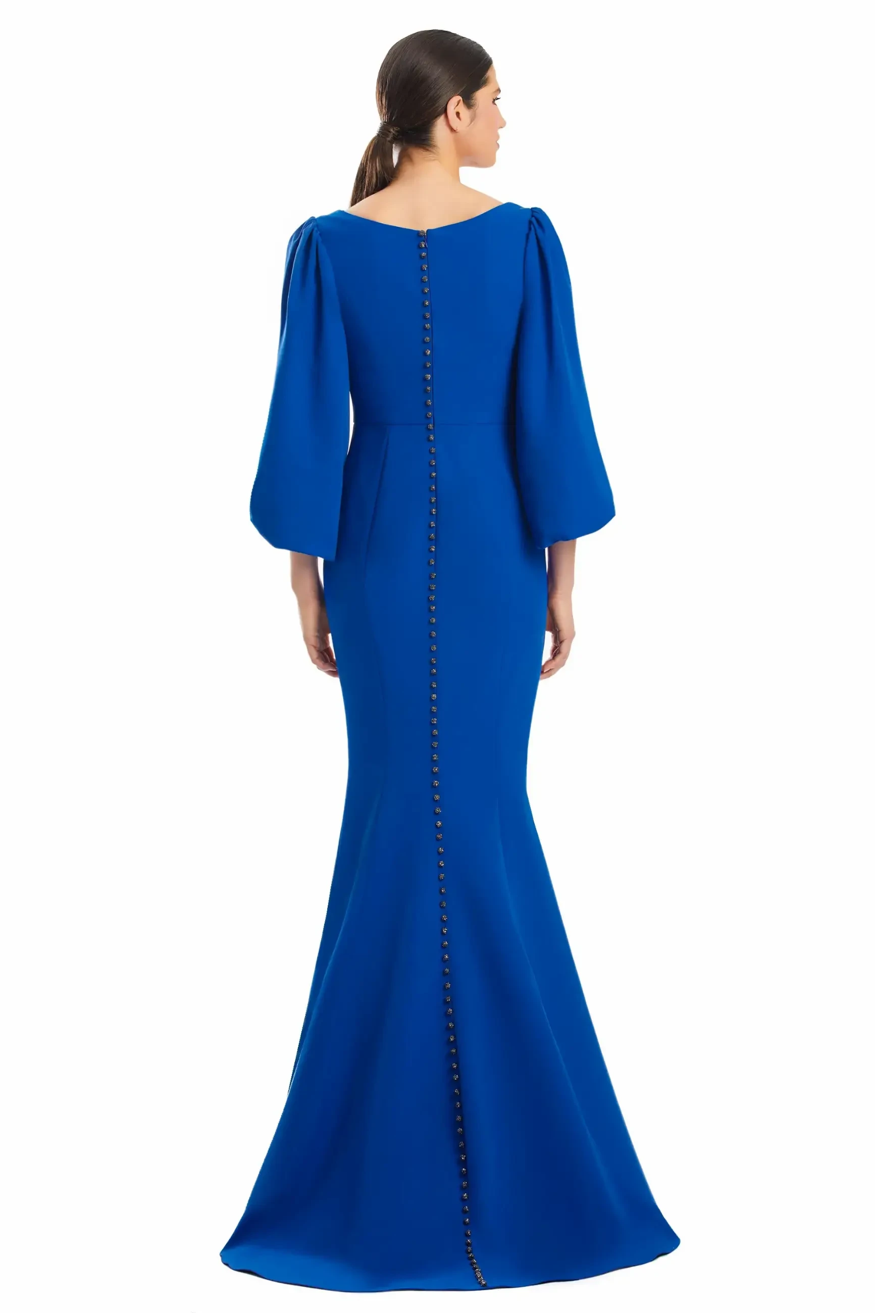 model is wearing a blue long sleeve mother of the bride gown
