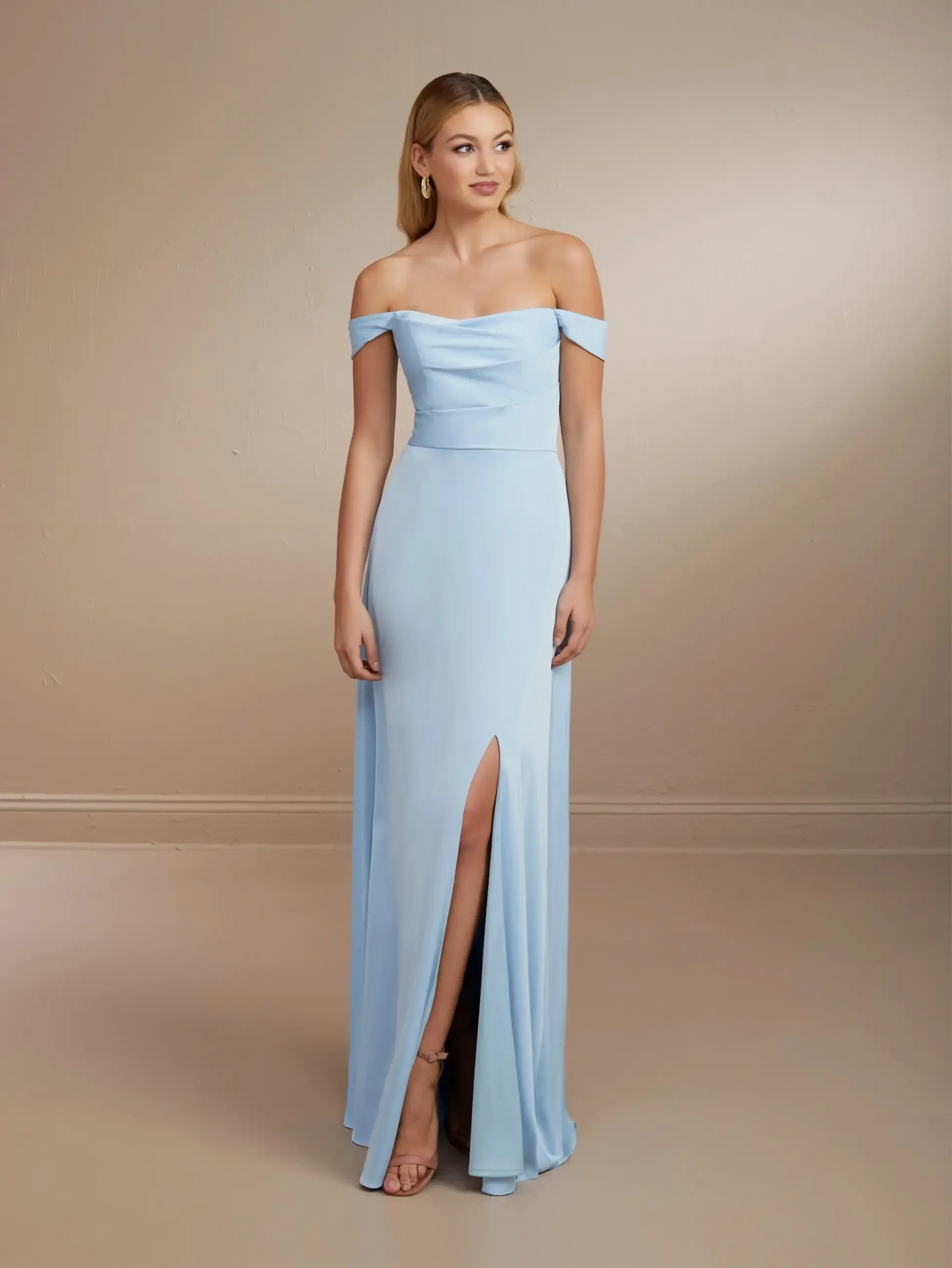 Model is wearing a chiffon off the shoulder sheath bridesmaid dress