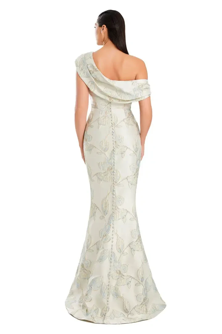 Model is wearing a one-shoulder mermaid gown that hugs the body and flares dramatically at the hem.
