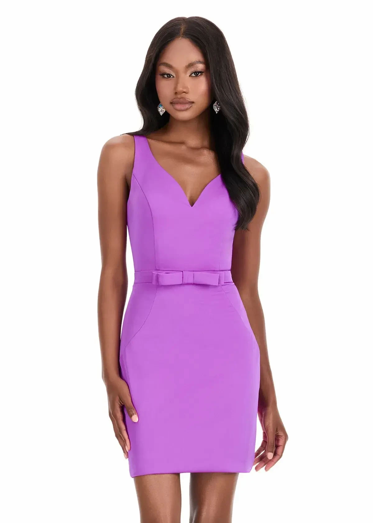 A model wearing a sleeveless, purple dress with a v-neck and a belted waist.