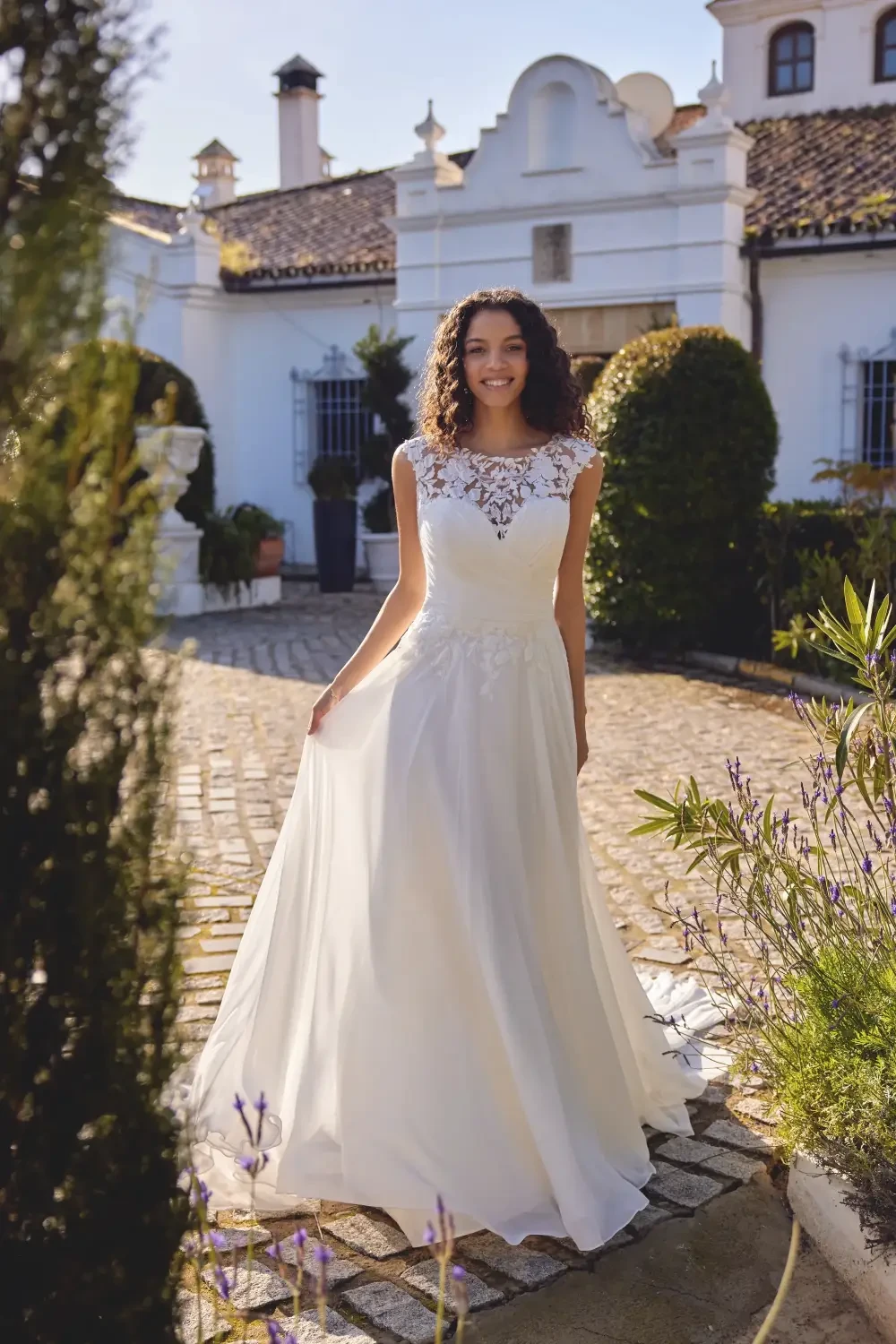 model is wearing an a-line bridal gown