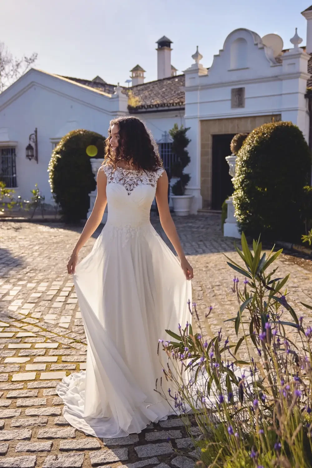 model is wearing an a-line bridal gown
