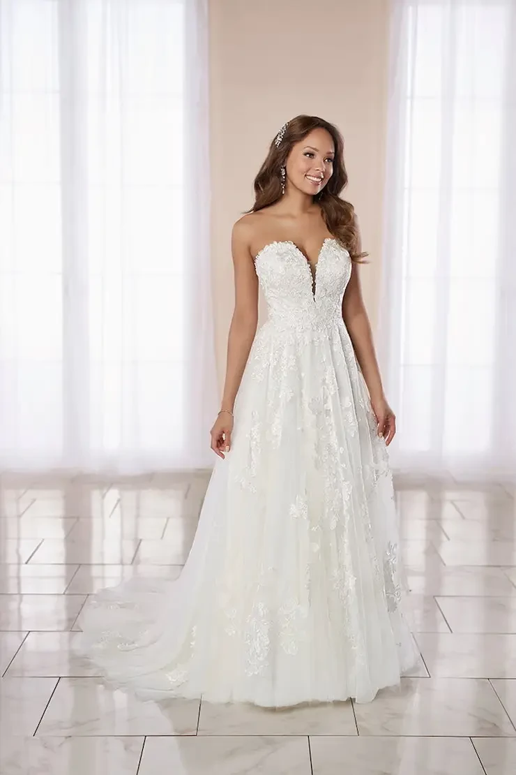 model is wearing a strapless a-line wedding gown
