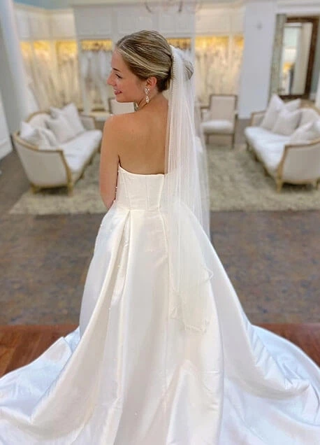 Model wearing a white gown