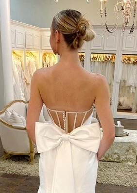 Model wearing a white bridal gown